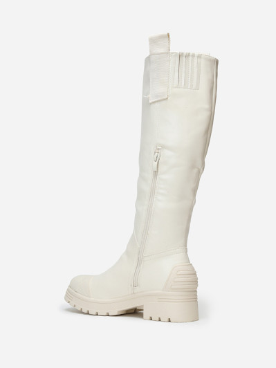 Bottes crèmes crantées avec motifs en relief