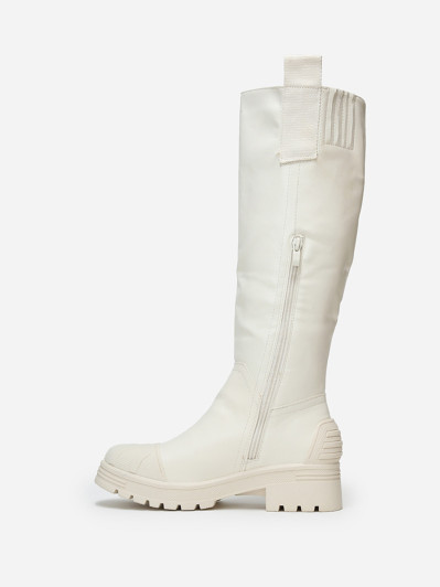 Bottes crèmes crantées avec motifs en relief