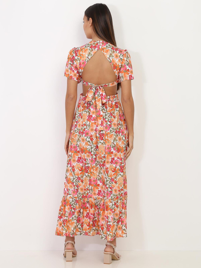 Robe longue blanche à fleurs orange avec découpes