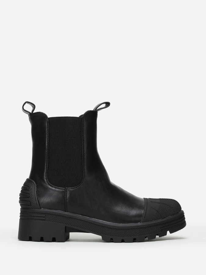 Chelsea noires crantées avec motifs en relief