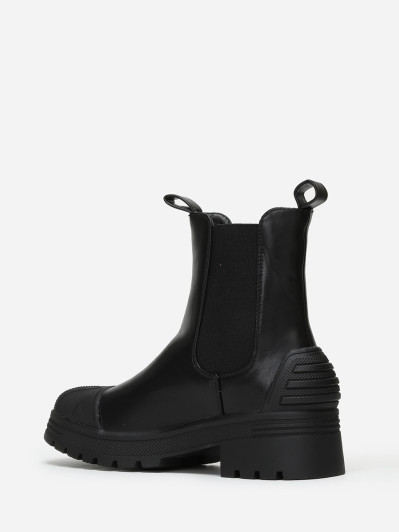 Chelsea noires crantées avec motifs en relief