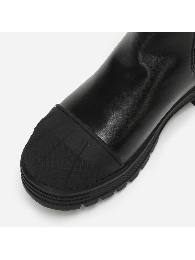 Chelsea noires crantées avec motifs en relief