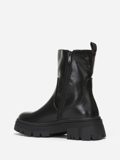 Bottines chelsea crantées en simili noir