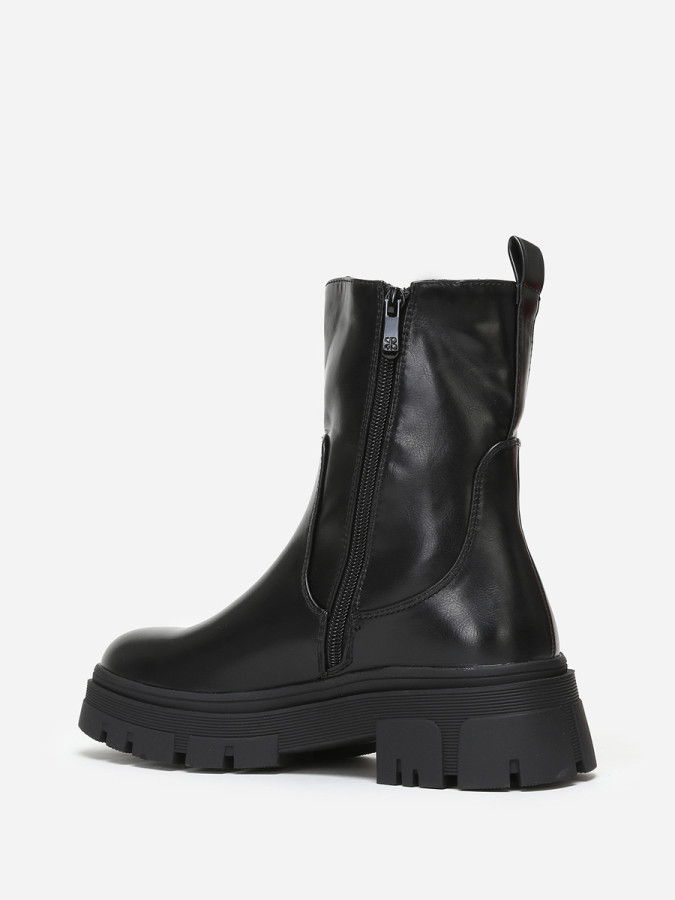 Bottines chelsea crantées en simili noir