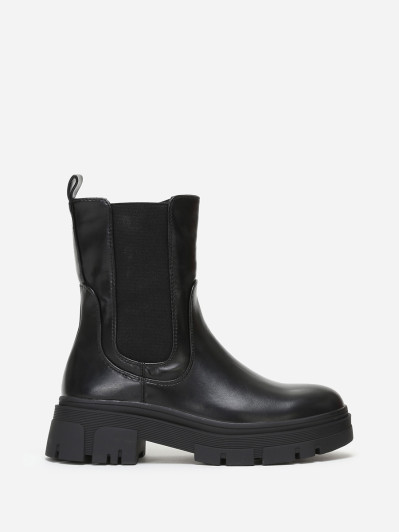 Bottines chelsea crantées en simili noir