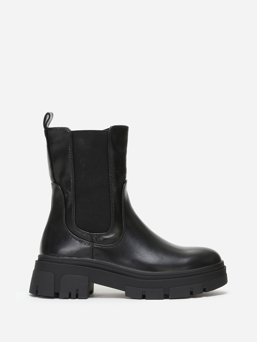 Bottines chelsea crantées en simili noir