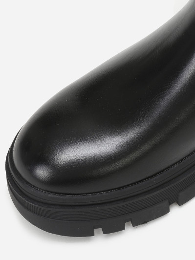 Bottines chelsea crantées en simili noir